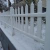 A white kitty lives here, probably snug inside warm and toasty.
