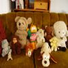 Here's who's left of the gang. My childhood best friends. We've got (from left to right) Grumpy Bear, Mr. Seal, Muchie Chie, Sleepy Bear (his arms are like that because his neck has no support so his head falls down... because he's sleepy!), Mr. Lion, Garfield (his shirt says Gimme! Gimme!, I got him for xmas one year, presumably because my xmas lists were always realllly long.  Gimme!), Ms. Elephant (she plays music from her butt), Odie dog (my absolute bestest friend), bear, lambie, and Lamb. I guess I was never too creative with the whole naming thing.