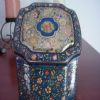 One of my mother's sewing tins. Now it houses leather braclets. Mom would be proud!